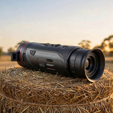 HIKMICRO Falcon FQ35 2.0 Thermal Monocular on top of a Hay Bale