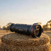 HIKMICRO Falcon FQ50L 2.0 Thermal Monocular on top of a Hay Bale