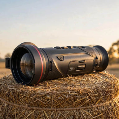HIKMICRO Falcon FQ50 2.0 Thermal Monocular on top of a Hay Bale