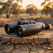 HIKMICRO HABROK 4K HE25L 2.0 Multi Spectrum Binoculars on top of a  Dry Dam Bank Clay