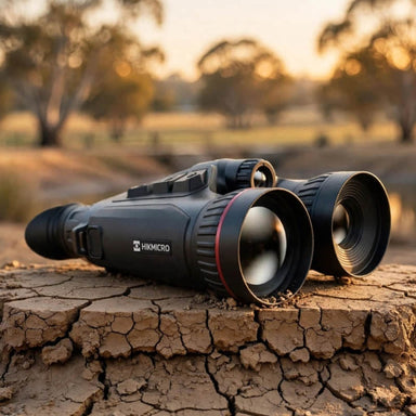 HIKMICRO HABROK 4K HX60LS Multi Spectrum Binoculars on top of a  Dry Dam Bank Clay