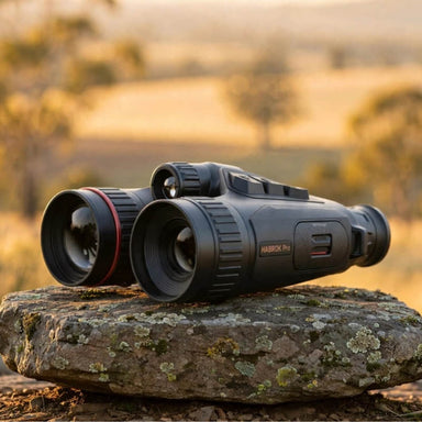 HIKMICRO Habrok Pro HQ50L(N) Multi-Spectrum Binocular on top of a  Granite Bush Rock
