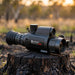 HIKMICRO Panther 2.0 PH35L Thermal Scope on top of a burnt stump