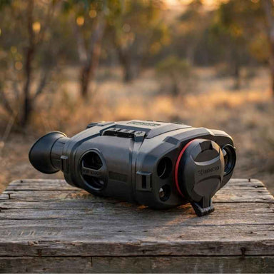 HIKMICRO Raptor RH50L Multi Spectrum Binoculars on top of a crate lid