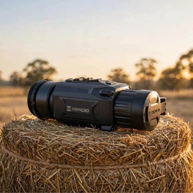 HIKMICRO Thunder TQ35CR 2.0 Thermal Clip-On on top of a Hay Bale