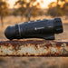 Hikmicro Lynx LQ35L 3.0 Thermal Monocular on top of a Rusty Farm Gate Rail