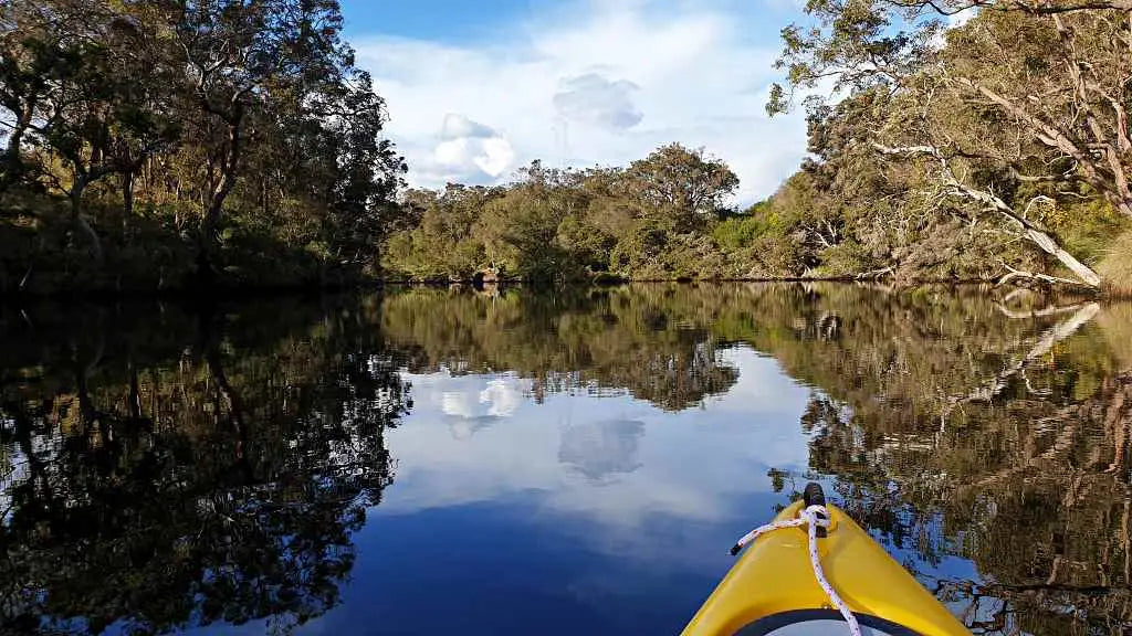 Good fishing kayak paddling in calm water